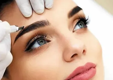 Close-up of microbladed brow strokes following natural hair growth