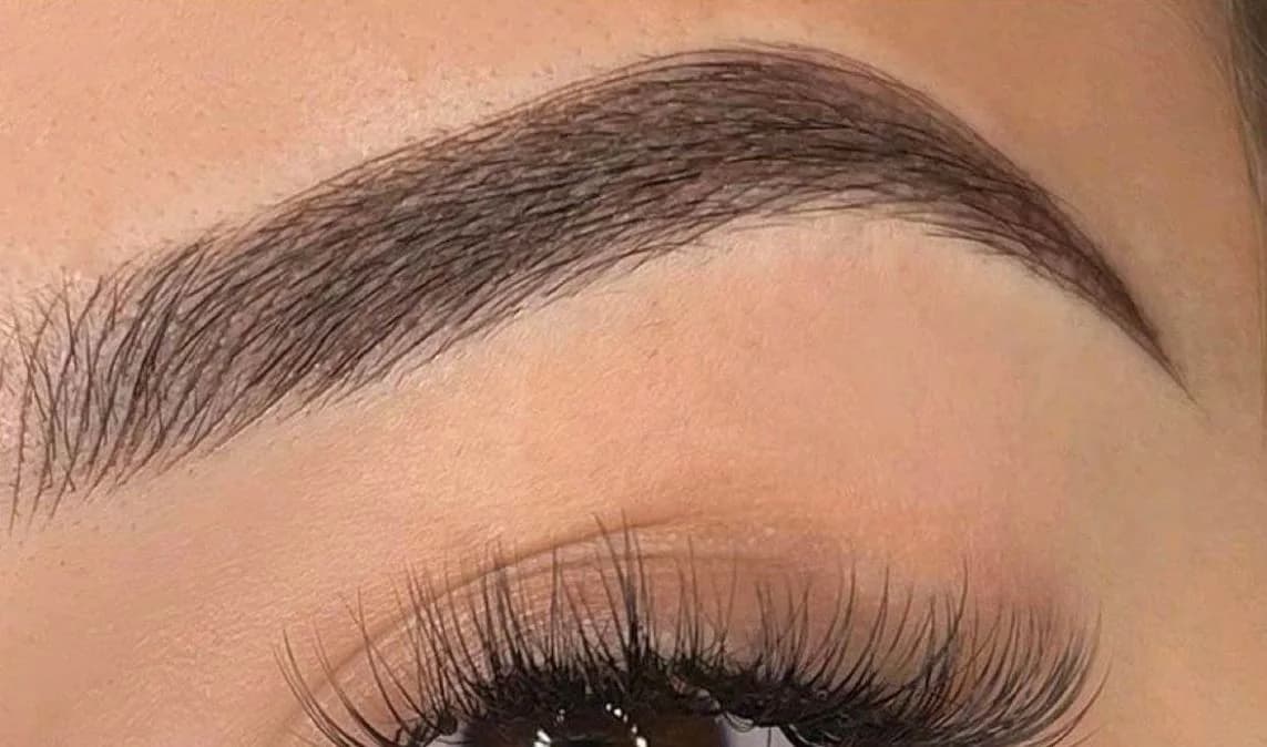 Healed nano combo brows showing stroke texture through the front of the brow