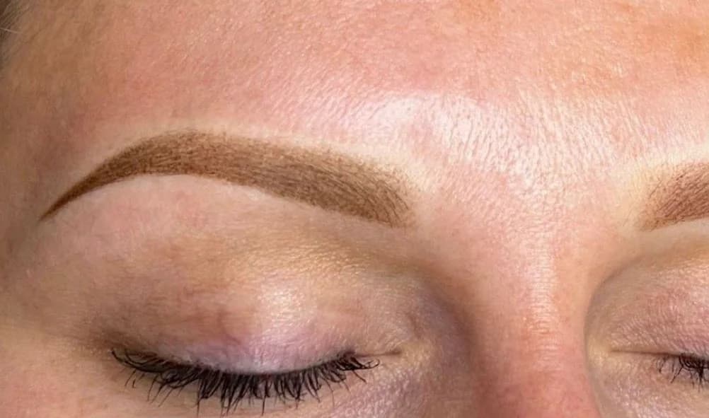 Ombré powder brows healed result, soft powdery shading on previously sparse brows
