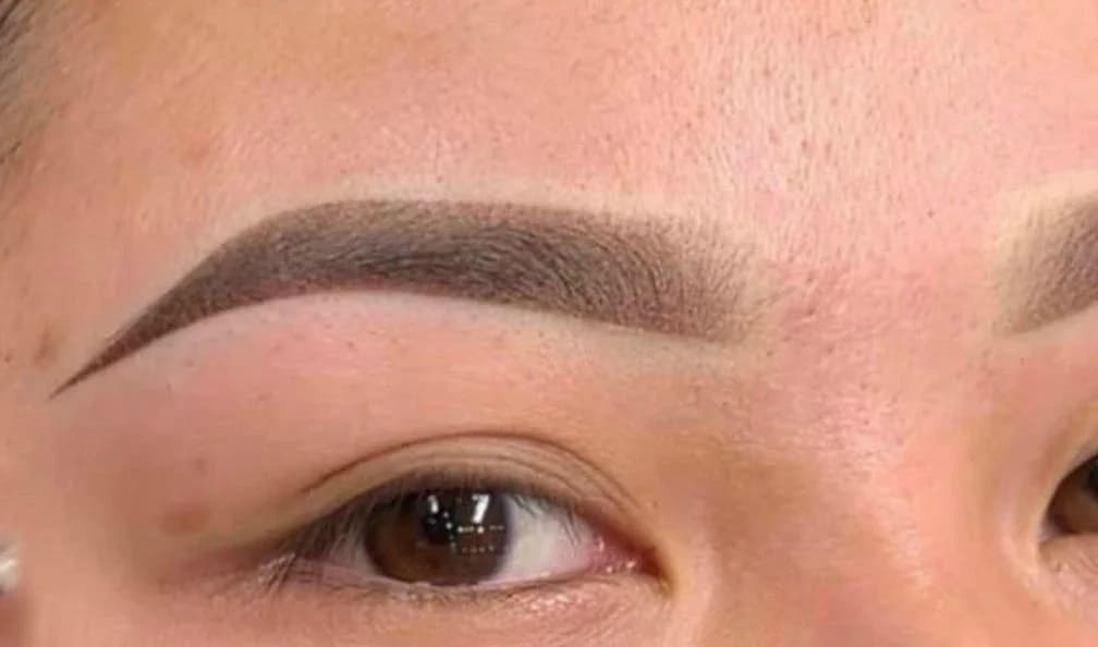 Ombré powder brows shaped and mapped to the face, healed