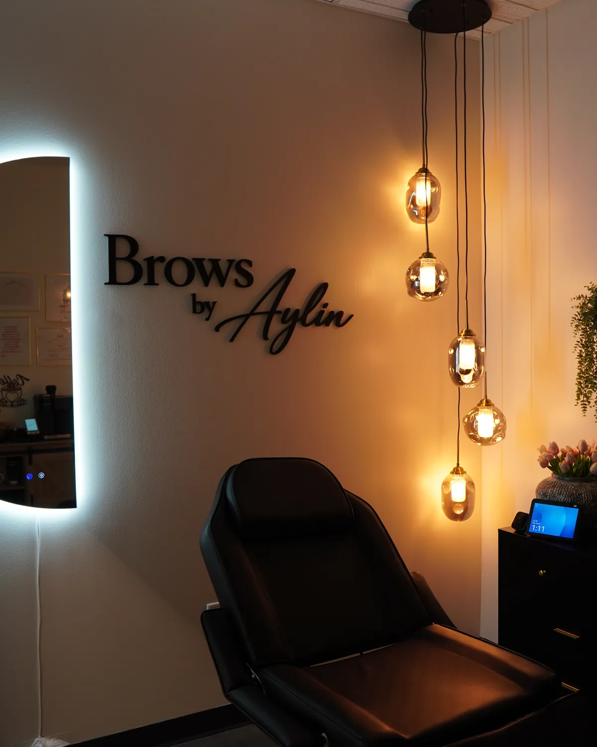 The Brows by Aylin private studio suite in Marietta, GA, with certifications framed on the wall
