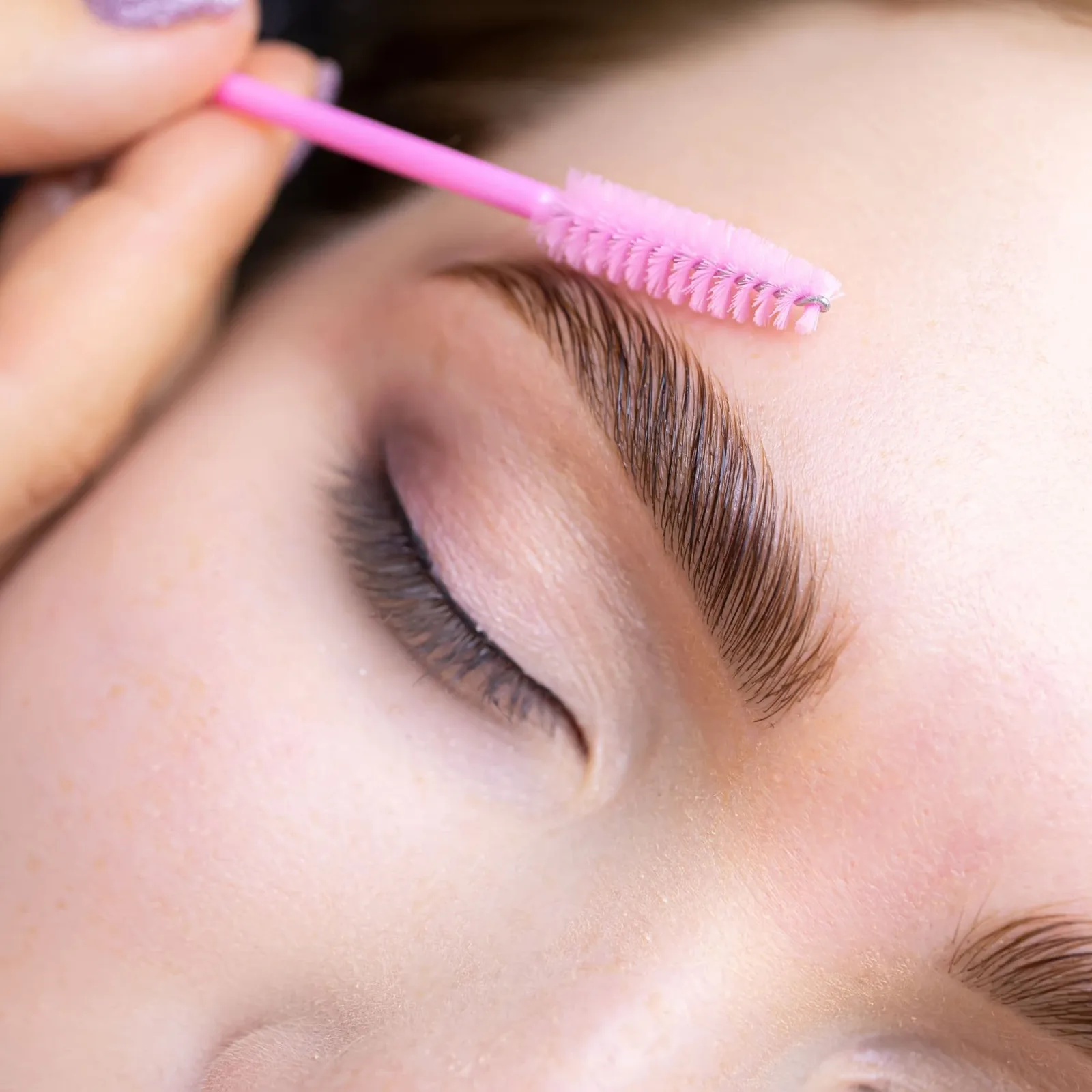 Laminated, tinted and waxed brows brushed up for a fuller, lifted look, Marietta GA