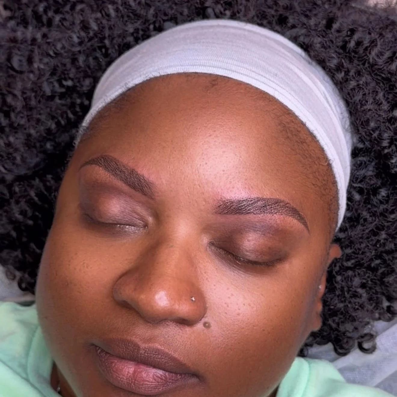 Healed ombré powder brows with a soft gradient from light front to deeper tail, Marietta GA